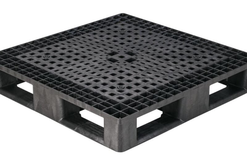 A black plastic pallet with holes.