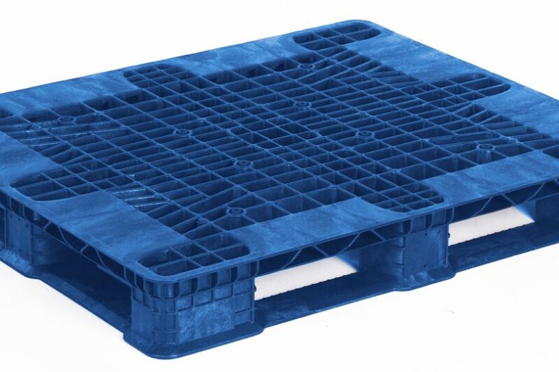 A blue plastic pallet on a white background.