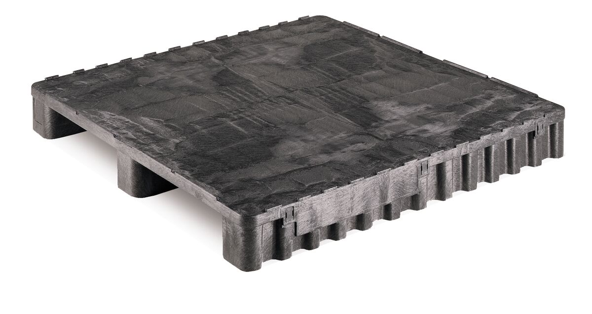 A black plastic pallet stands on a white background.