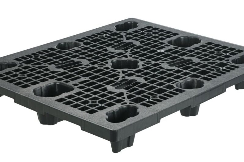 A black plastic tray with holes, commonly used as a pallet.