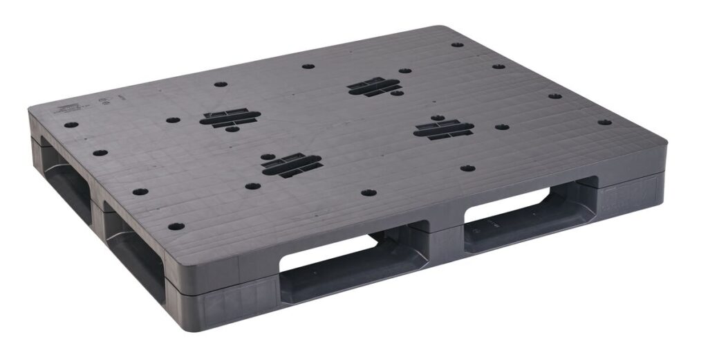 A black plastic pallet with ventilation holes, handle cutouts, and a closed deck, seen against a white background. This 40 x 48 ODYSSEY HD CLOSED DECK model offers durability and functionality.