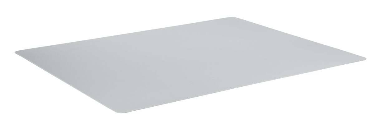 A gray plastic cutting board sits on a white surface.