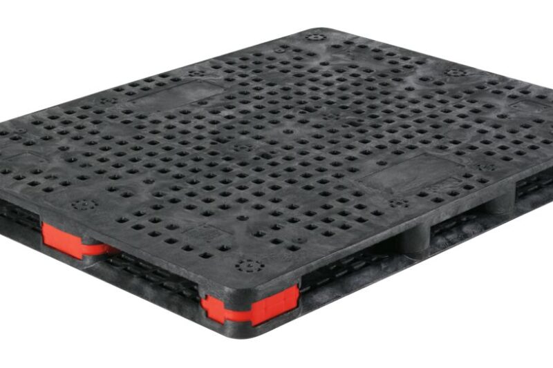 A plastic pallet with black and red handles.