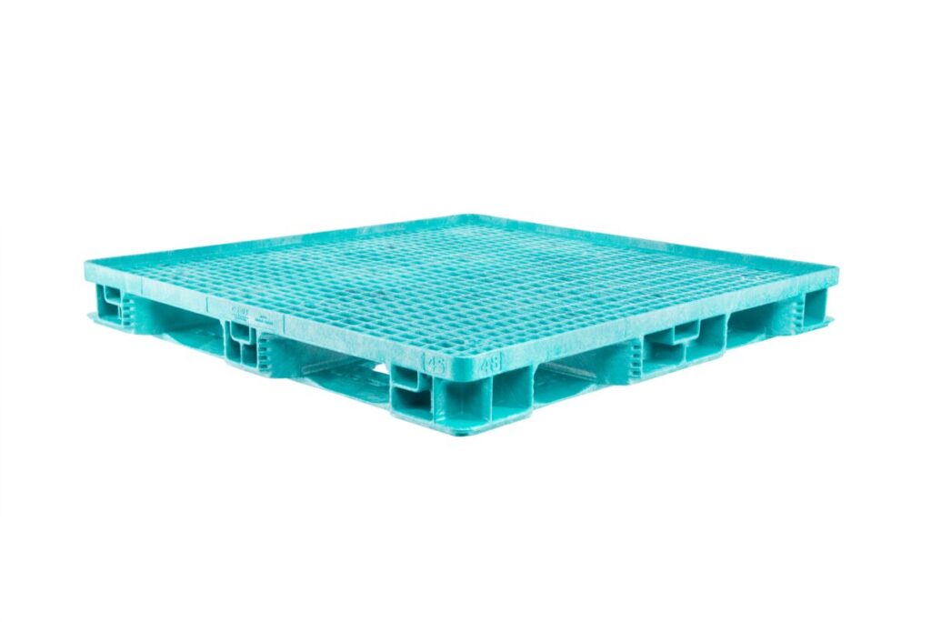 A blue plastic pallet against a white backdrop.