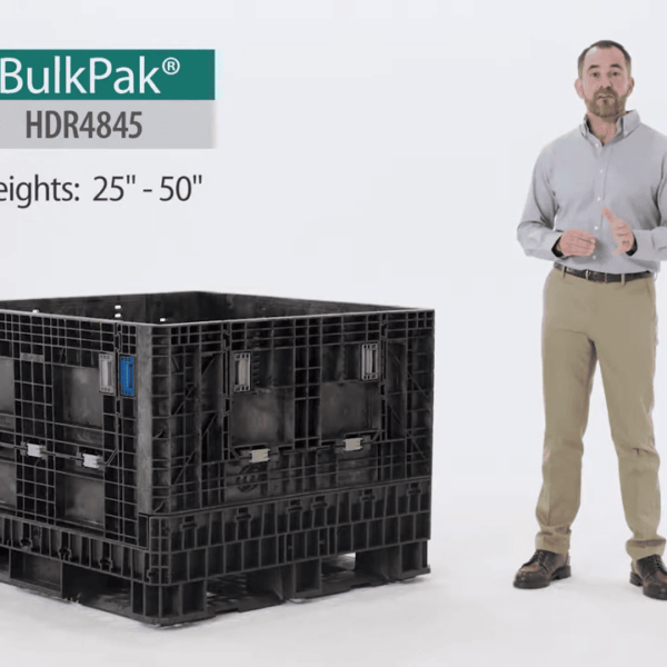 A man stands next to a black HDR4845-25 BulkPak container, which has adjustable heights ranging from 25 to 50 inches.