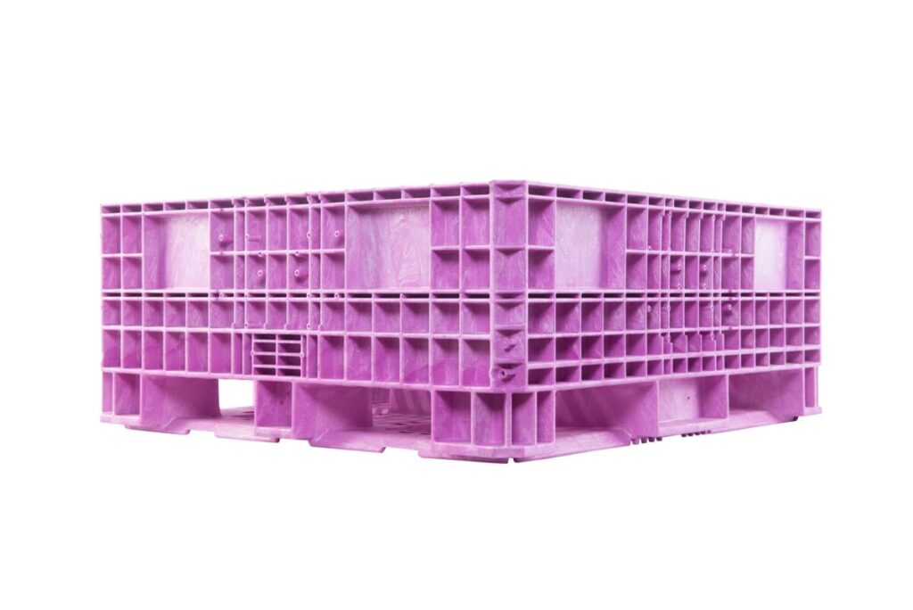 A collapsible pink plastic bulk bin