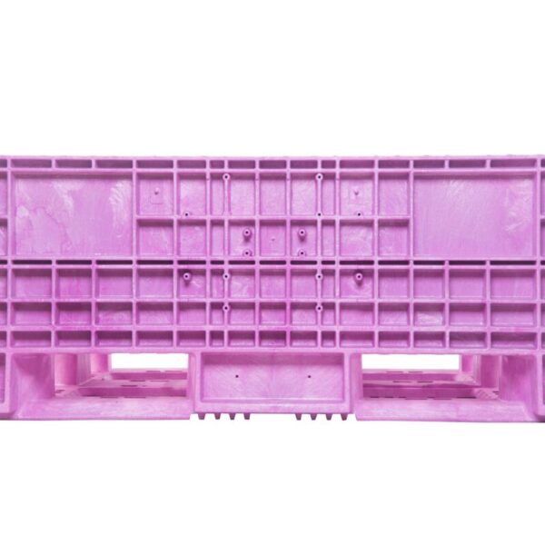 A collapsible pink plastic bulk bin