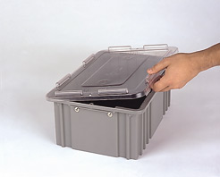 A hand is opening the lid of a gray plastic storage container against a plain white background.