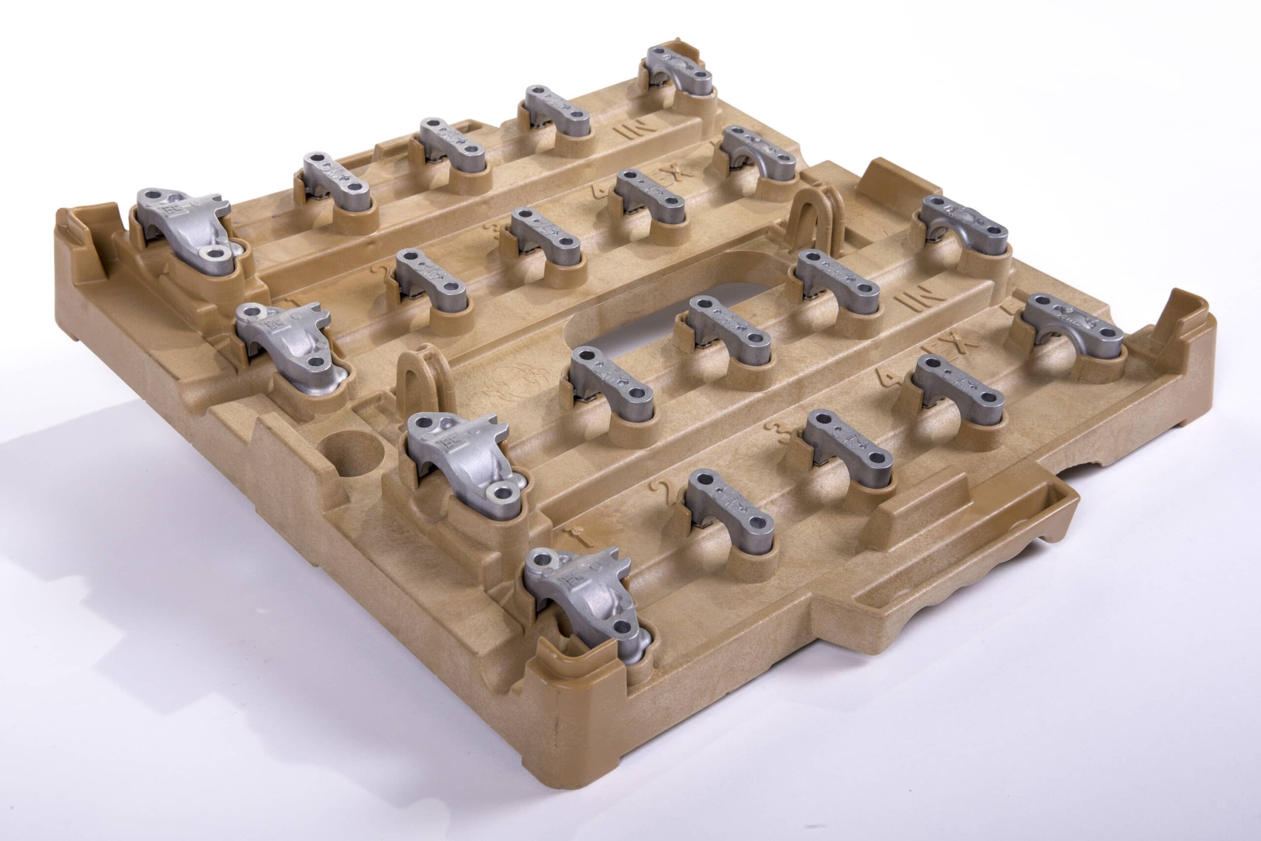 An injection molded beige plastic tray features multiple metal clamps arranged in three rows, perfect for industrial or mechanical purposes.